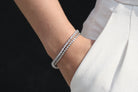 Sterling Silver Bracelet, Round Cut, Prong Clasp, Round Cut Bezel Bracelet in Silver, Pure Sterling Silver, AAA Grade Cubic Zirconia Stones, Silver, Dainty Tennis Bracelet, Men's Jewelry, Women's Jewelry, Men's Bracelet, Women's Bracelet, Unisex Bracelet, Aritzia White Effortless Pants, Black Wall, Fair Skin, Hand in Pocket