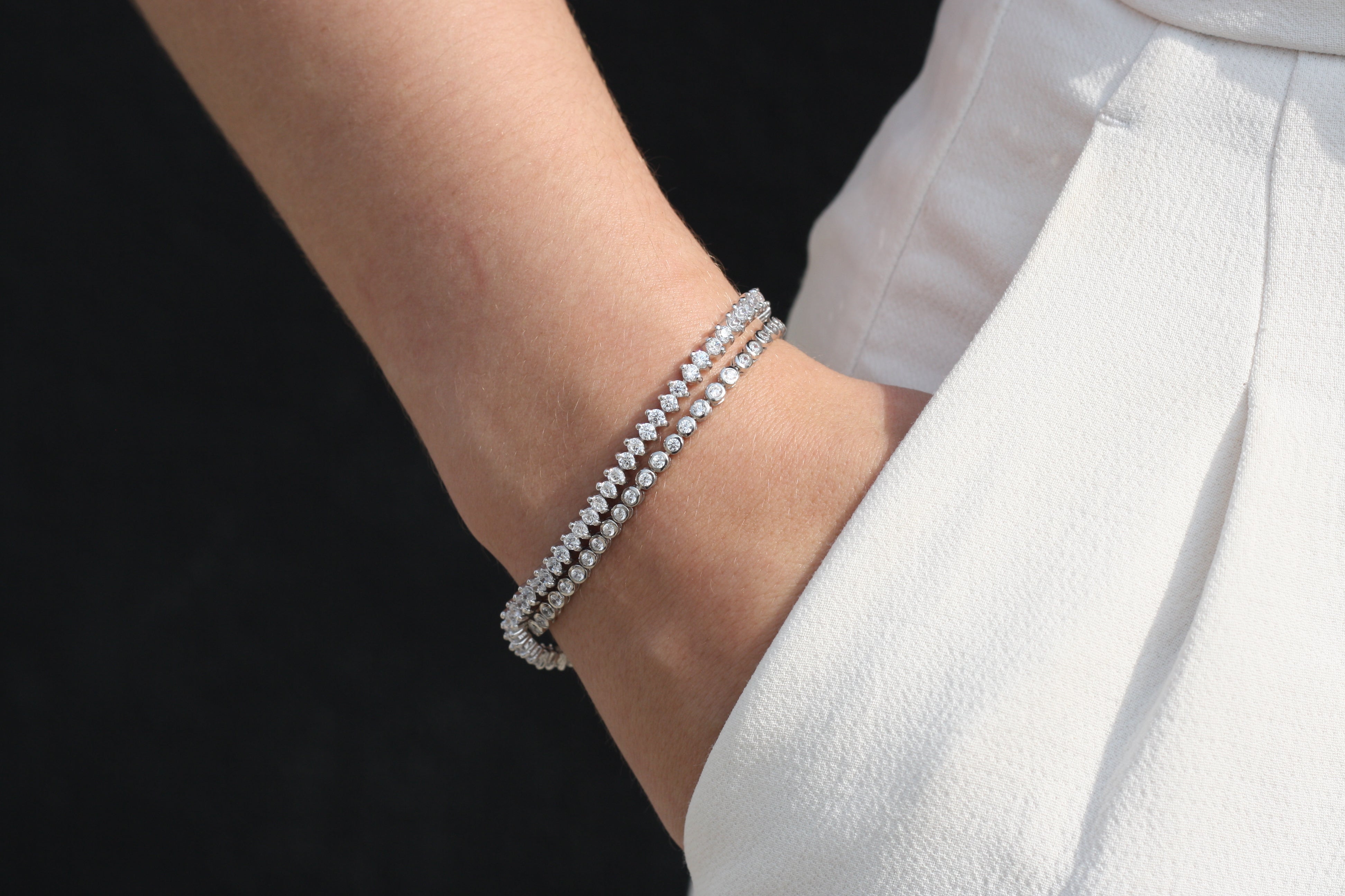 Sterling Silver Bracelet, Round Cut, Prong Clasp, Round Cut Bezel Bracelet in Silver, Pure Sterling Silver, AAA Grade Cubic Zirconia Stones, Silver, Dainty Tennis Bracelet, Men's Jewelry, Women's Jewelry, Men's Bracelet, Women's Bracelet, Unisex Bracelet, Aritzia White Effortless Pants, Black Wall, Fair Skin, Hand in Pocket