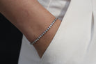 Sterling Silver Bracelet, Round Cut, Prong Clasp, Round Cut Bezel Bracelet in Silver, Pure Sterling Silver, AAA Grade Cubic Zirconia Stones, Silver, Dainty Tennis Bracelet, Men's Jewelry, Women's Jewelry, Men's Bracelet, Women's Bracelet, Unisex Bracelet, Aritzia White Effortless Pants, Black Wall, Fair Skin, Hand in Pocket